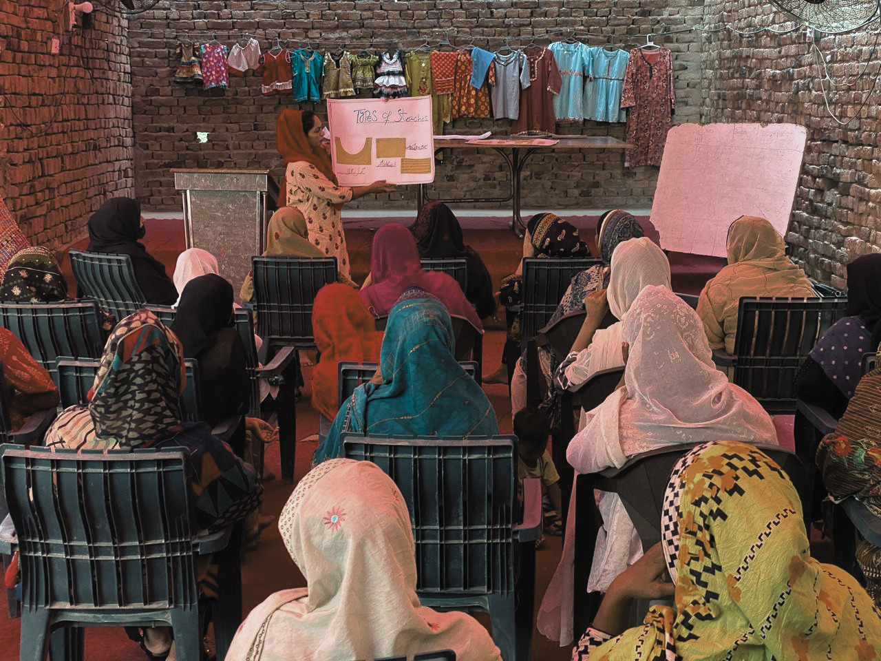 A group of women working together in the Jenerosity Sewing Center workshop