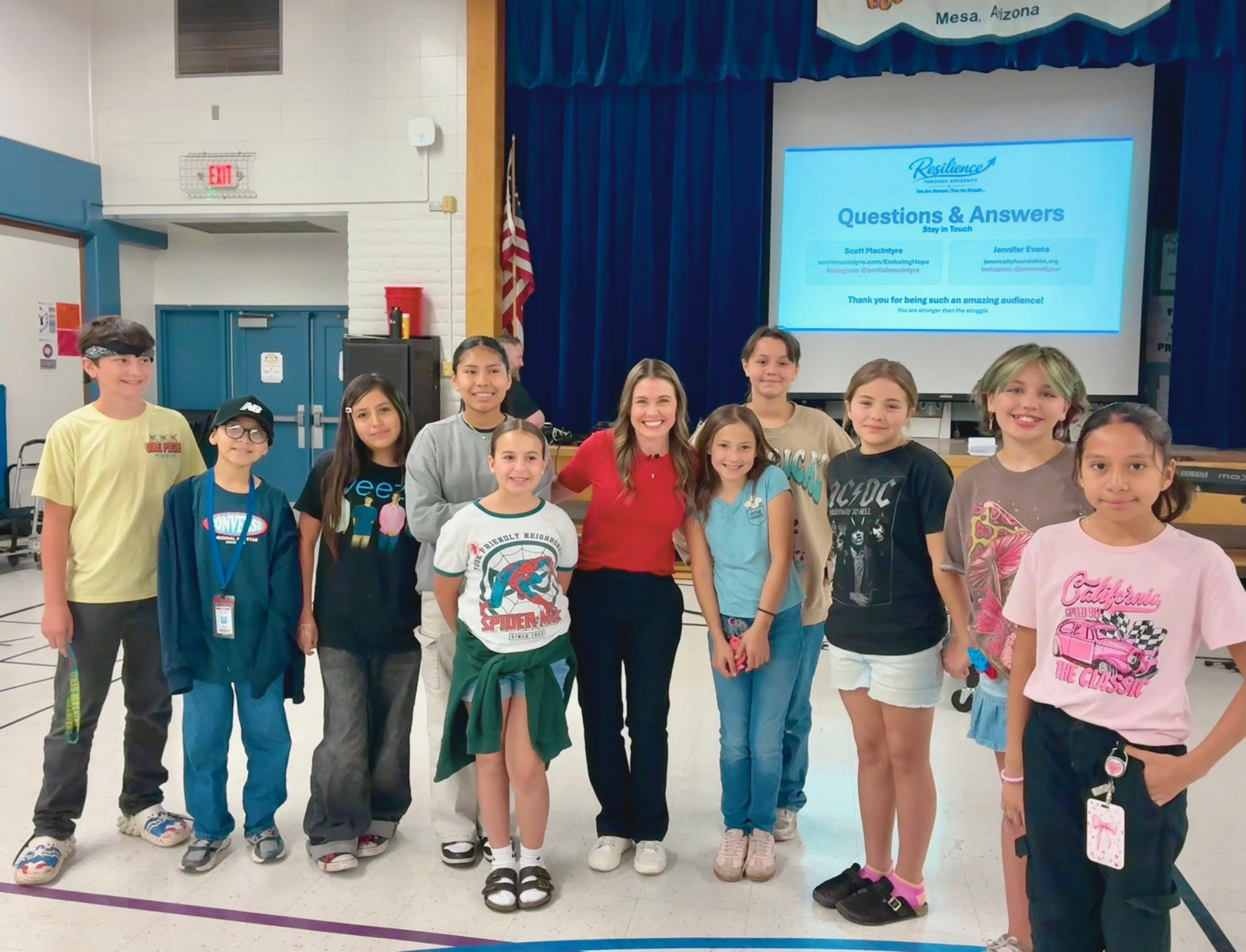 Jennifer Evans with middle school students after a Resilience Through Adversity school assembly on addiction prevention