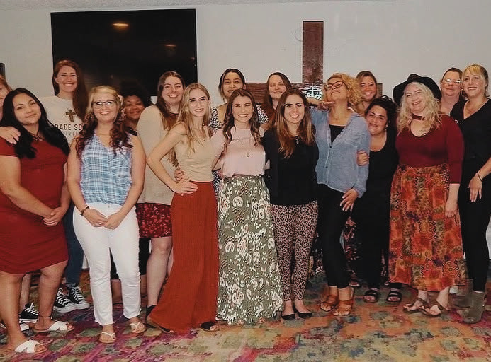 Jennifer Evans with a group of women at a recovery center outreach event