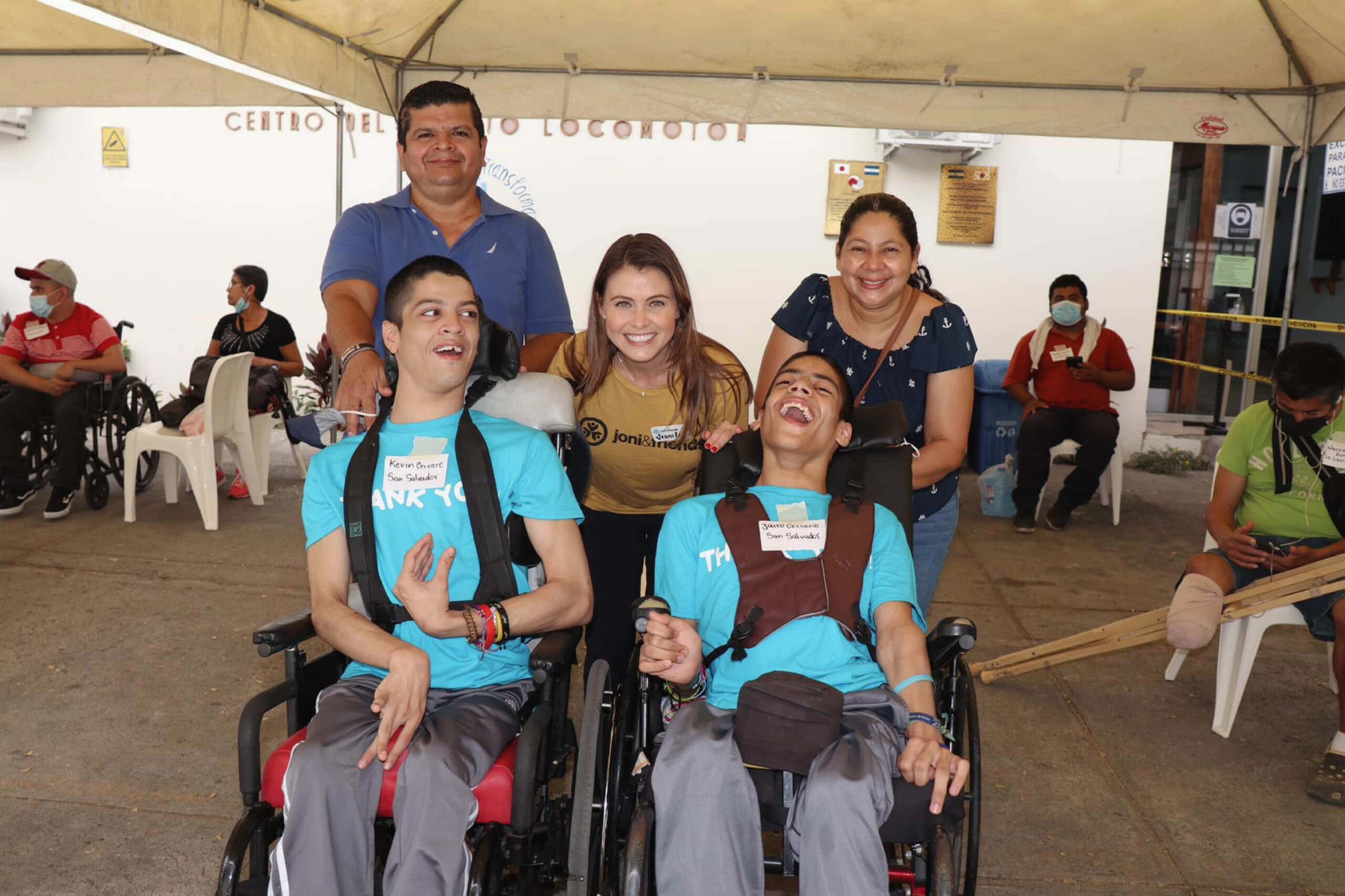 Jennifer Evans with two young men who received wheelchairs through a Wheels for the World outreach