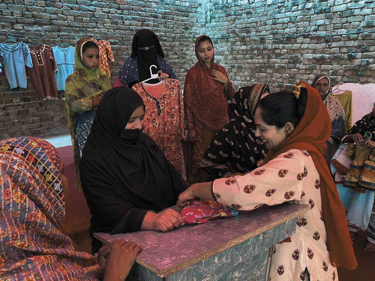 A woman learning to sew to support herself at the Jenerosity Sewing Center